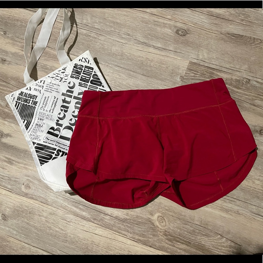 Lululemon Speed Up 2.5 inseam shorts. Bright red.